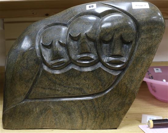 Henry Munyaradzi (1931-1998). A sectional stone carving depicting three faces within a reserve height 40cm, width 51.5cm